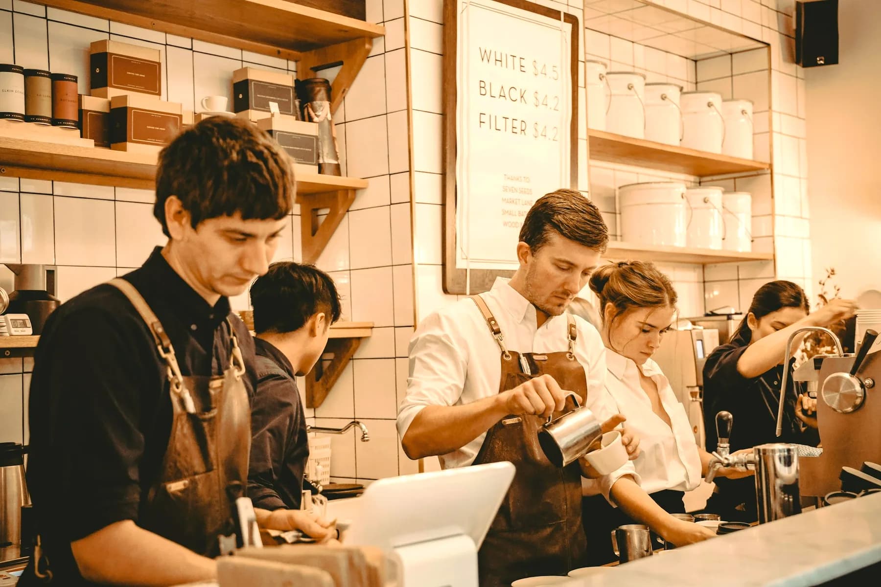 Baristas working a busy café counter